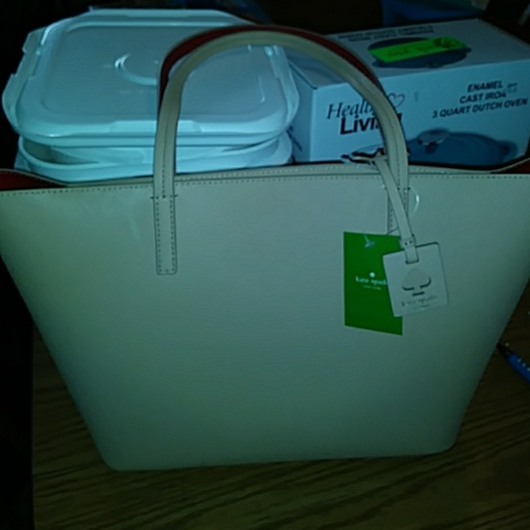 Beige in color Kate Spade zippered purse - Picture 1 of 5